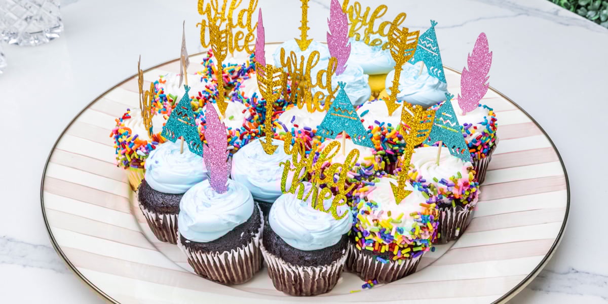 plate of birthday cupcakes on quartz countertops outdoors