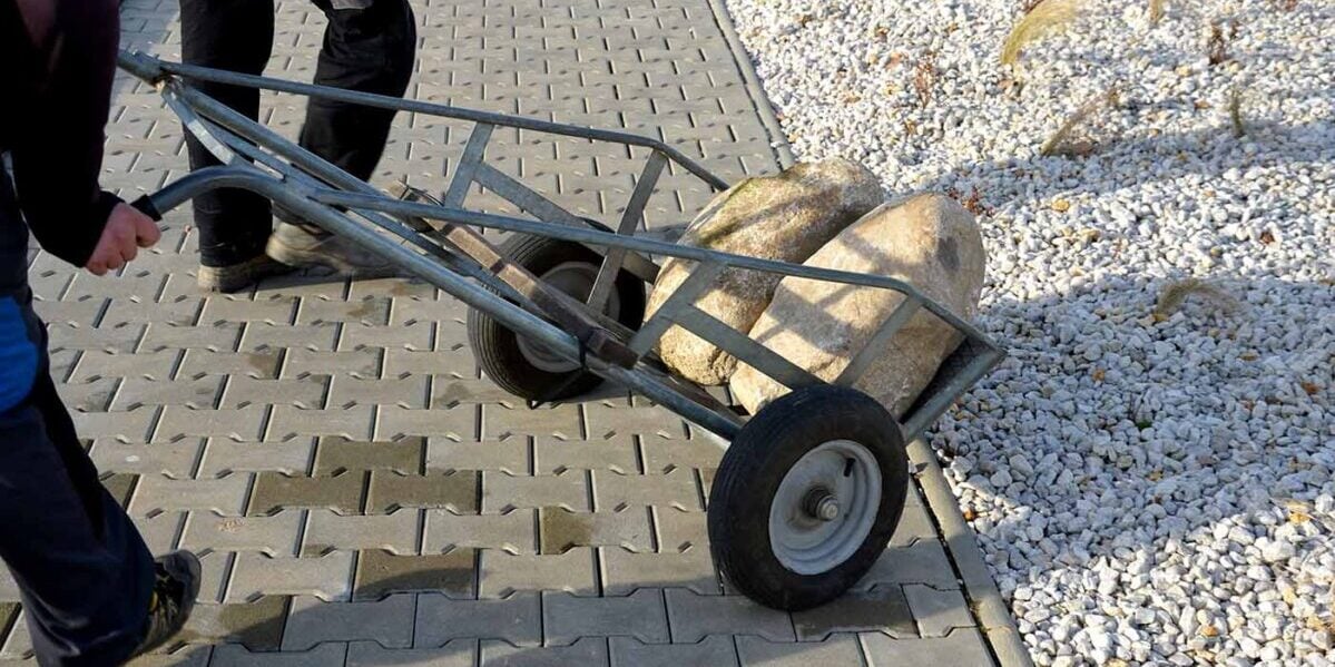 a couple large stone being transported to a job site