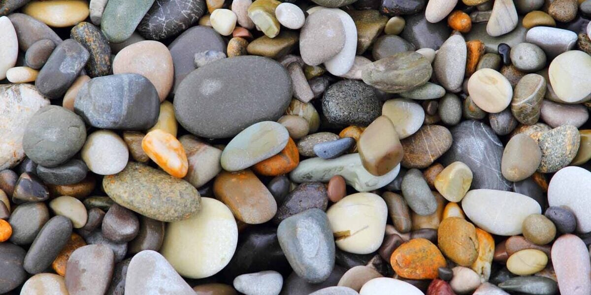 a photo of river stone that hasnt been picked up yet