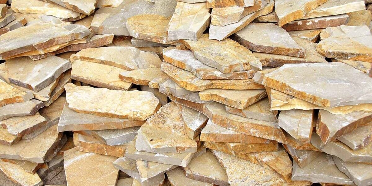 a pile of flagstone being ready to use for an outdoor kitchen