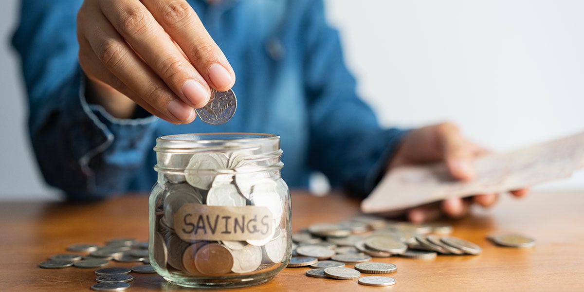a woman gathering her savings for an outdoor kitchen project