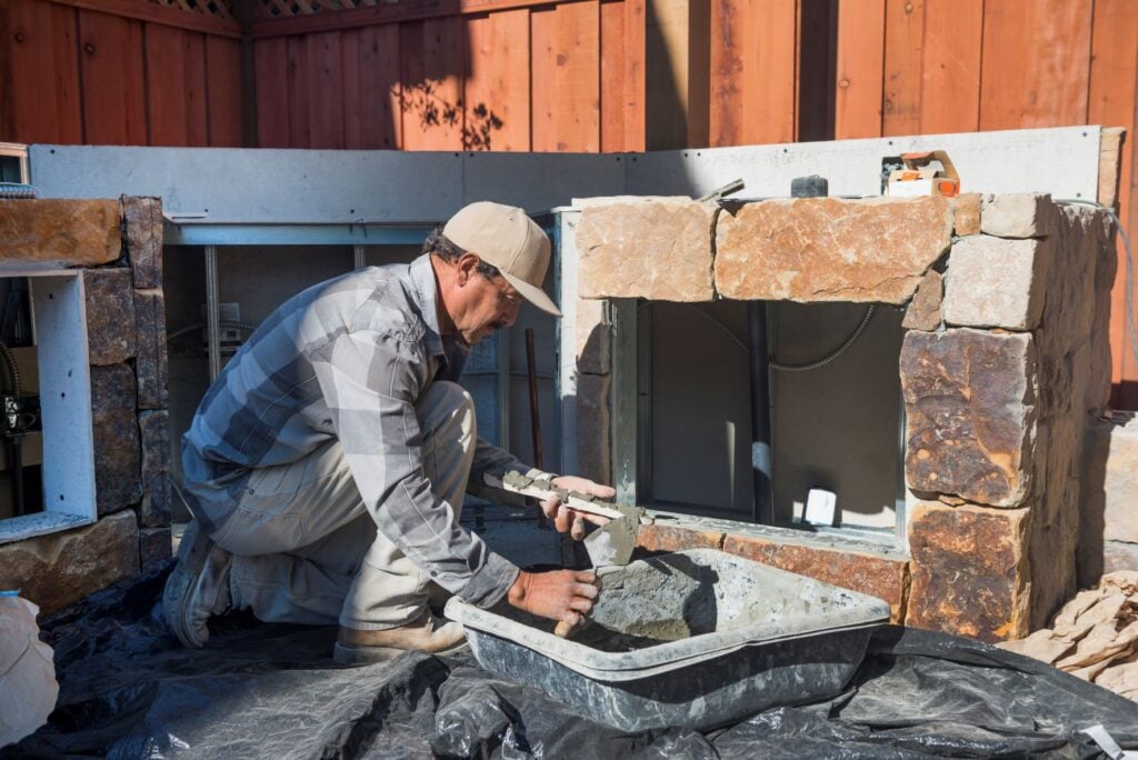 Contractor working on a ready to finish kitchen after being paid