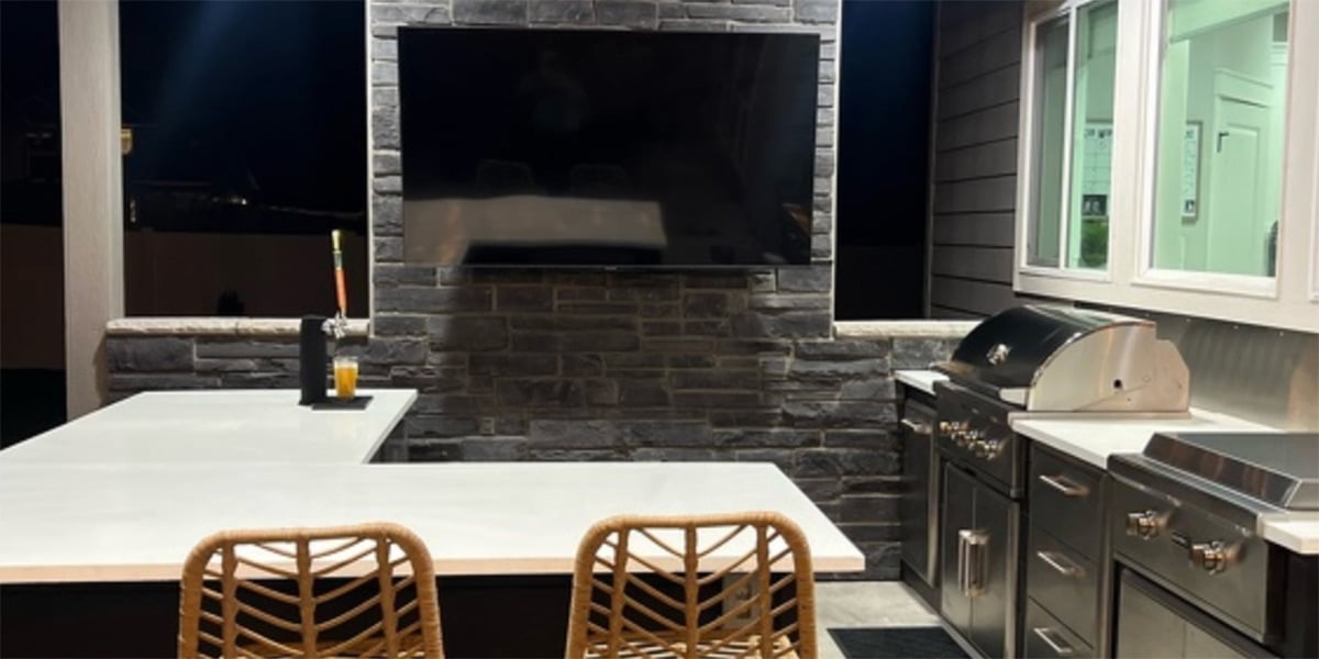 bar island with seating and outdoor tv