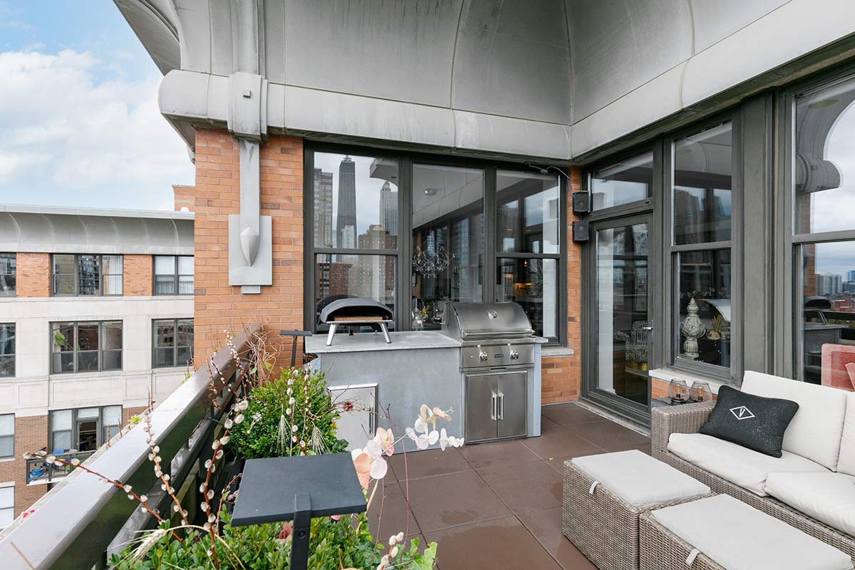 bbq island on balcony with outdoor sofa