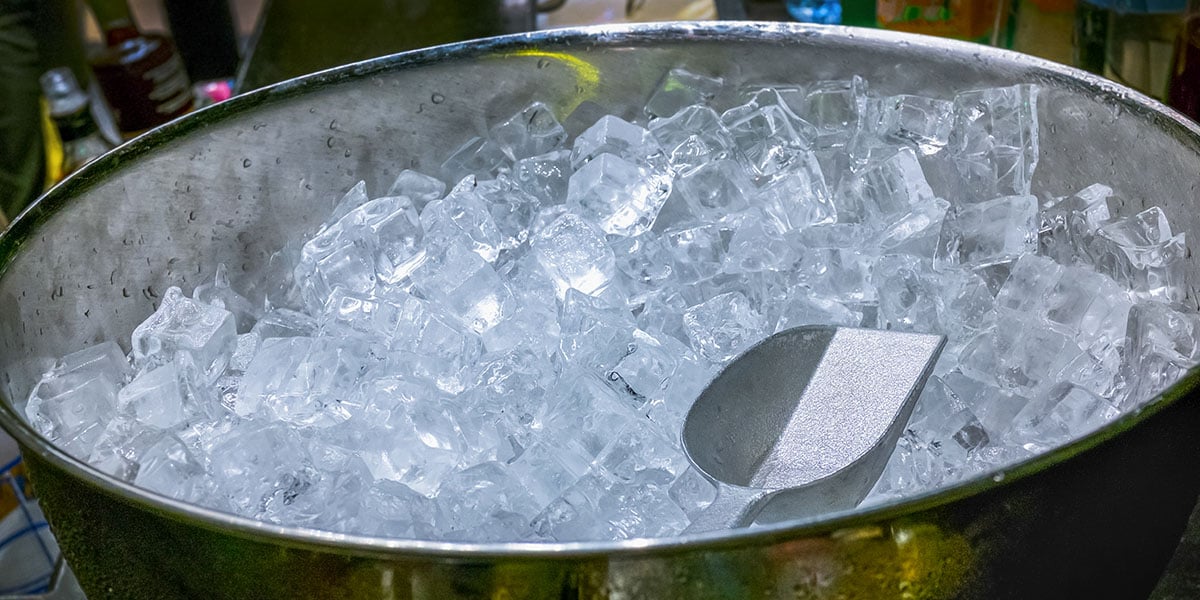 bowl of ice sitting at outdoor kitchen ready to use
