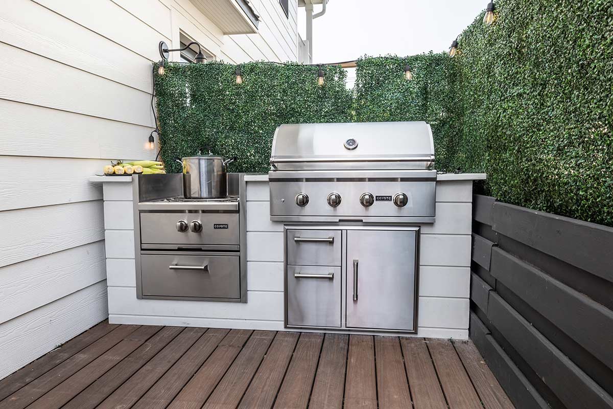 built in gas grill with power burner and combo storage in outdoor kitchen