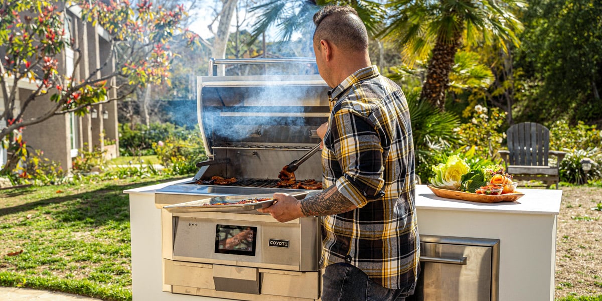 chef jet tila cooking on pellet grill small outdoor kitchen design