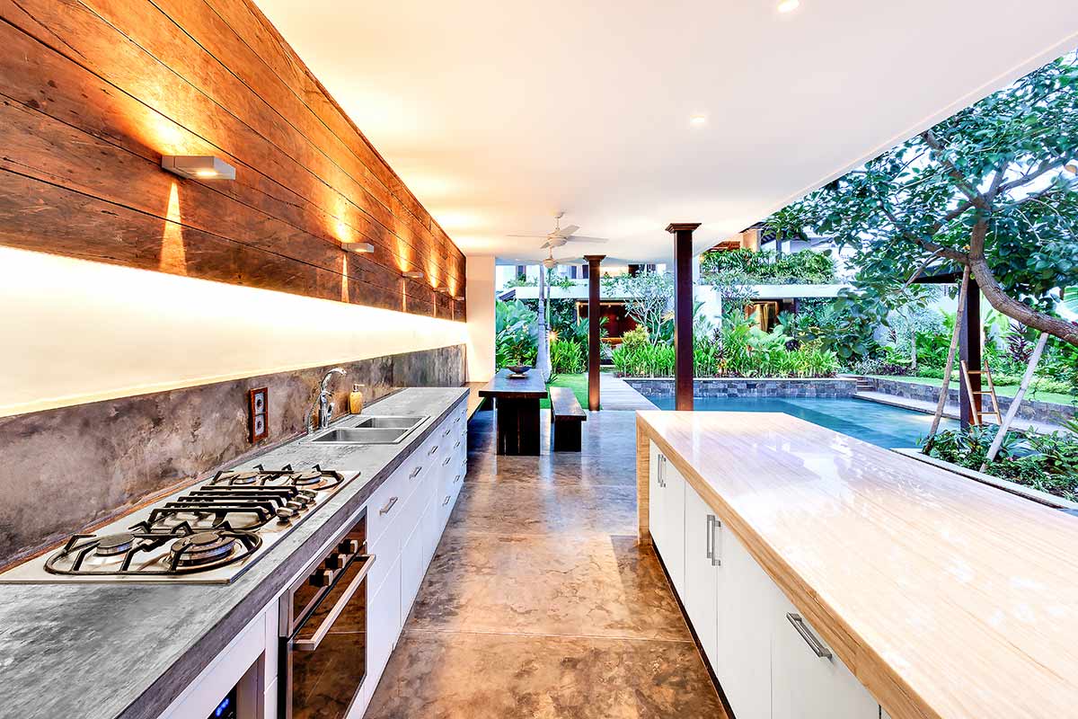 concrete backsplash on galley outdoor kitchen