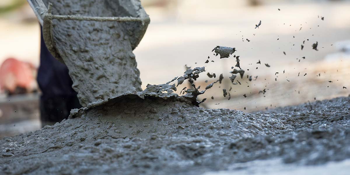 concrete being poured from truck