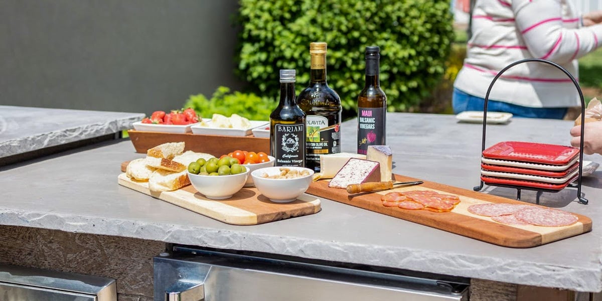 concrete outdoor kitchen countertops with charcuterie setup on top