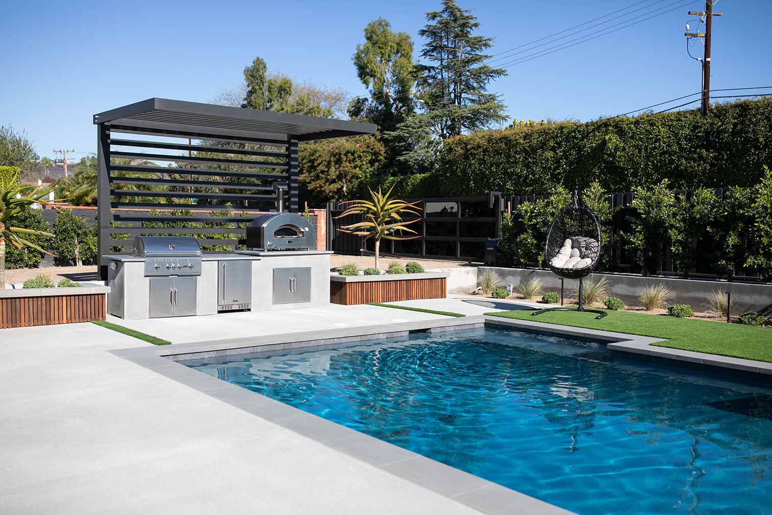 concrete rta outdoor kitchen poolside