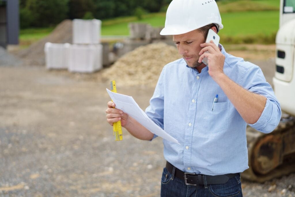 contractor calling customer to make a change order for outdoor kitchen