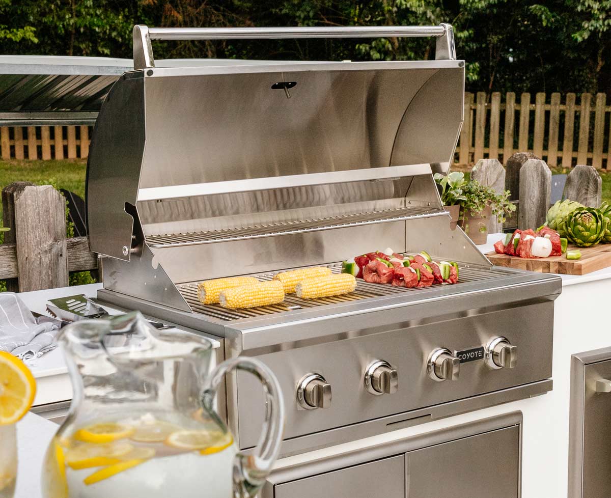cooking food on a coyote c series premium built in gas grill
