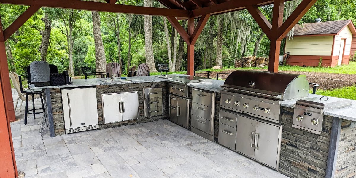 covered outdoor kitchen under pavilion