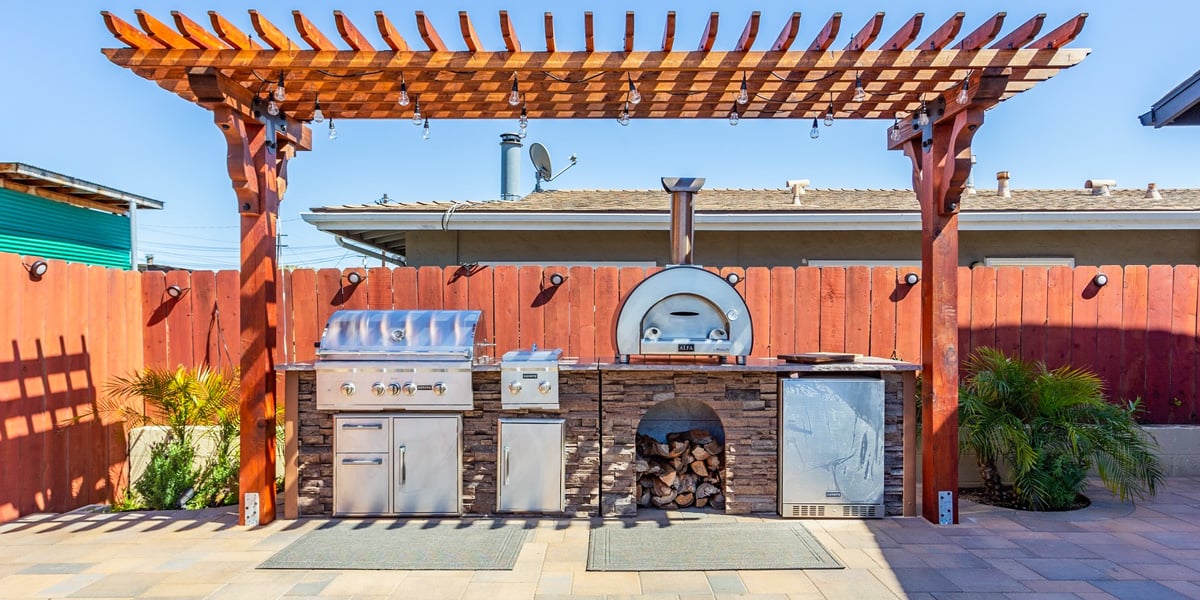 covered outdoor kitchen with pergola