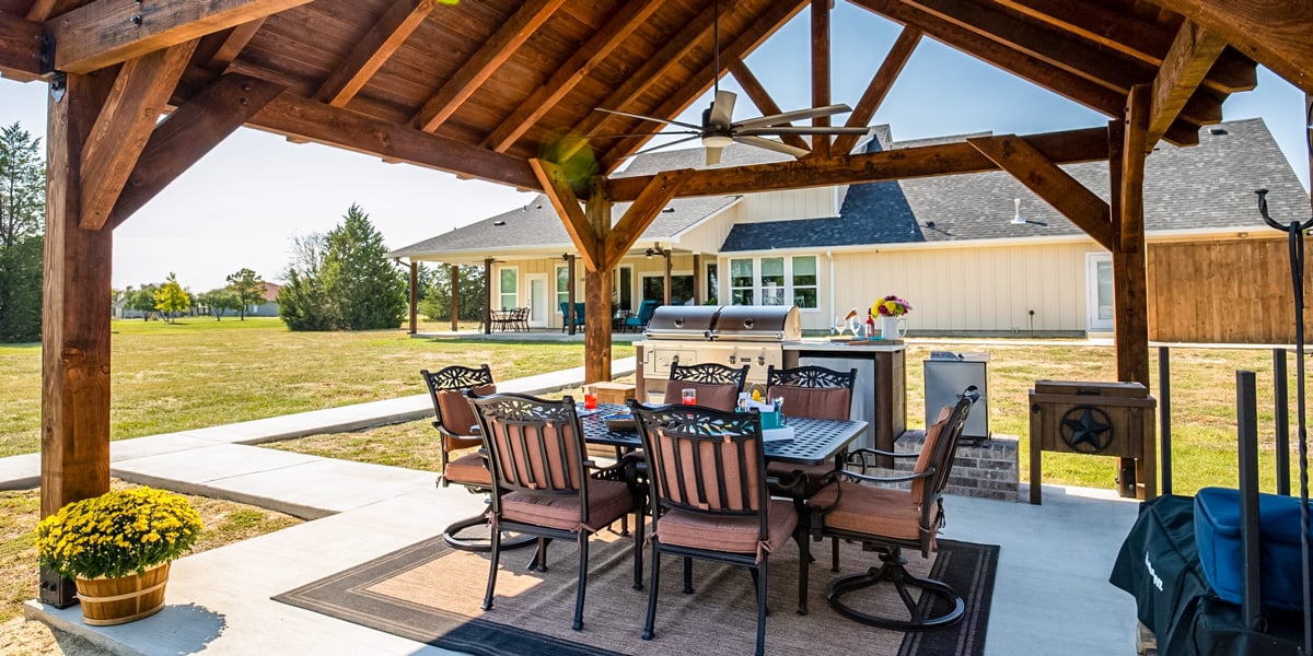covered rustic outdoor kitchen