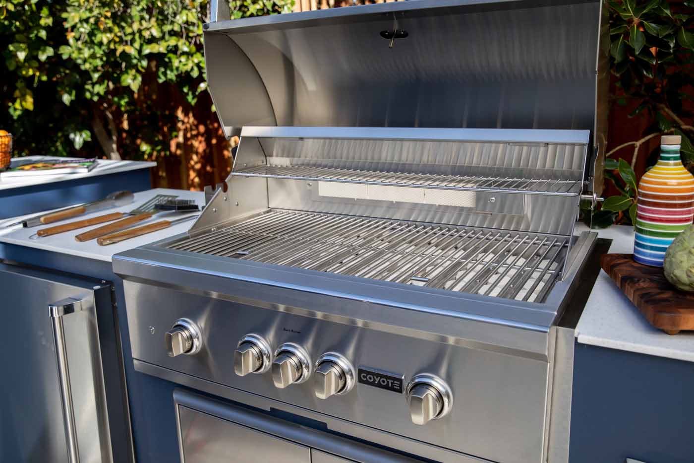 coyote 36 in s series grill built into a moks outdoor kitchen