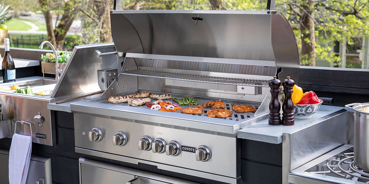 coyote brand s series grill model built into outdoor kitchen