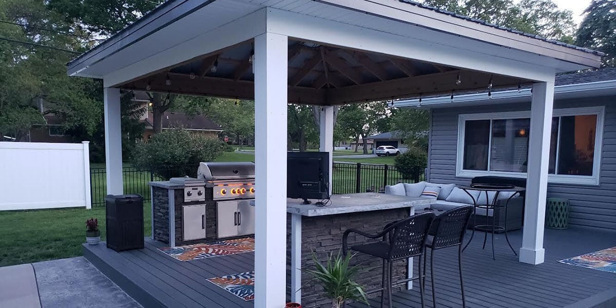 custom rta outdoor kitchen under roof structure with tv