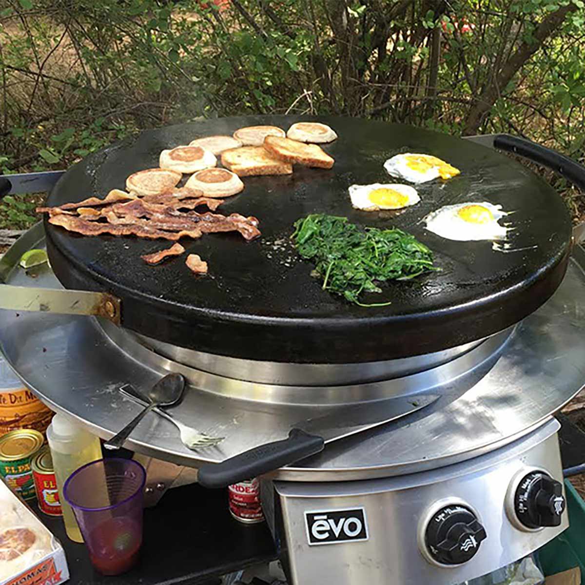 In fact, it’s actually designed with heat retention in mind! Evo claims that the round cooking surface will be able to retain even, “edge-to-edge” heat “without the hot spots and temperature problems prone to traditional square griddles.” As a reminder, all flat top Evo grills have variable temperatures between 225-550 degrees Fahrenheit (with the exception being the 25G, which only heats up to a max of 525 degrees). This wide temperature range means that you can use an Evo griddle to saute, sear, braise, stir fry, and toast... And the included stainless steel lid will fit perfectly on a round Evo flat top grill, allowing you to effectively trap in heat while cooking. This means steaming, roasting, and baking are also possible! Ultimately, Evo grills have a good amount of versatility! And as with any flat top grill, cooking should be a breeze. But what about when you’re done cooking? Is an Evo grill easy to clean and maintain?