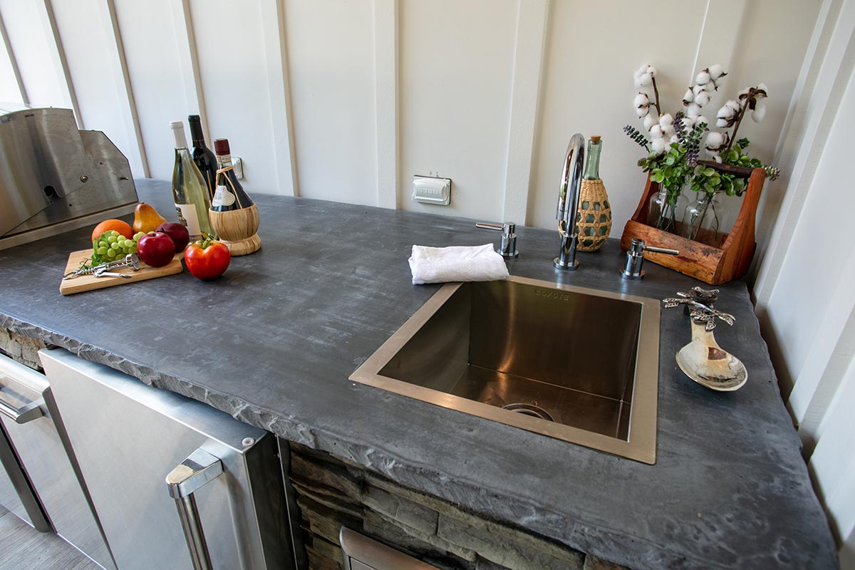 faucet with hot and cold knobs in outdoor kitchen