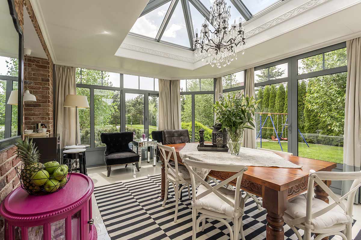 Florida room with table and chairs and chandilier