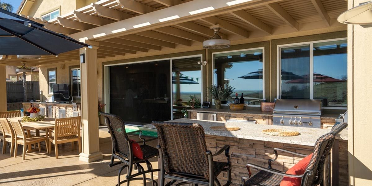 galley style outdoor kitchen with bar seating