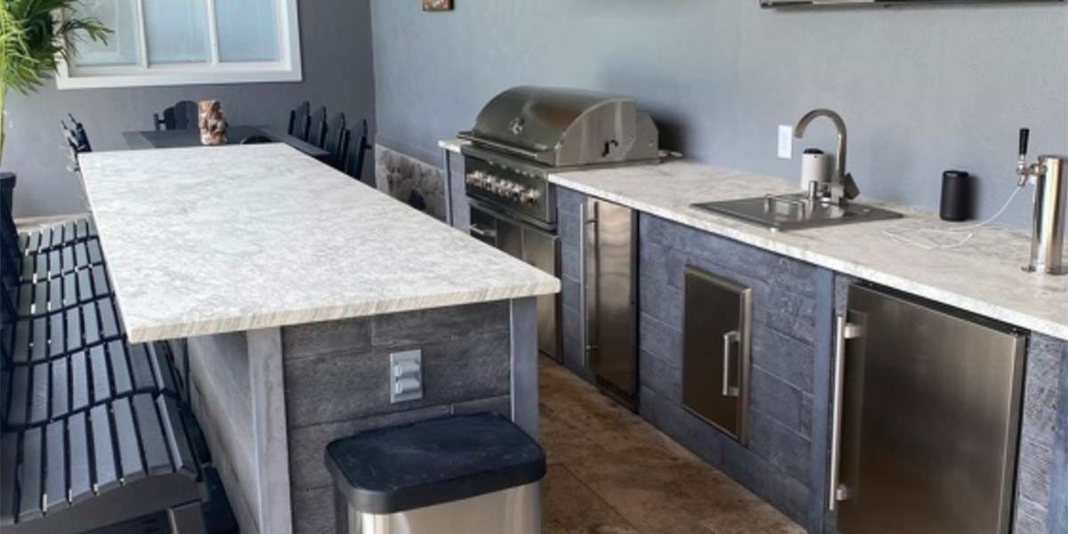 Galley style outdoor kitchen in weathered wood ash.