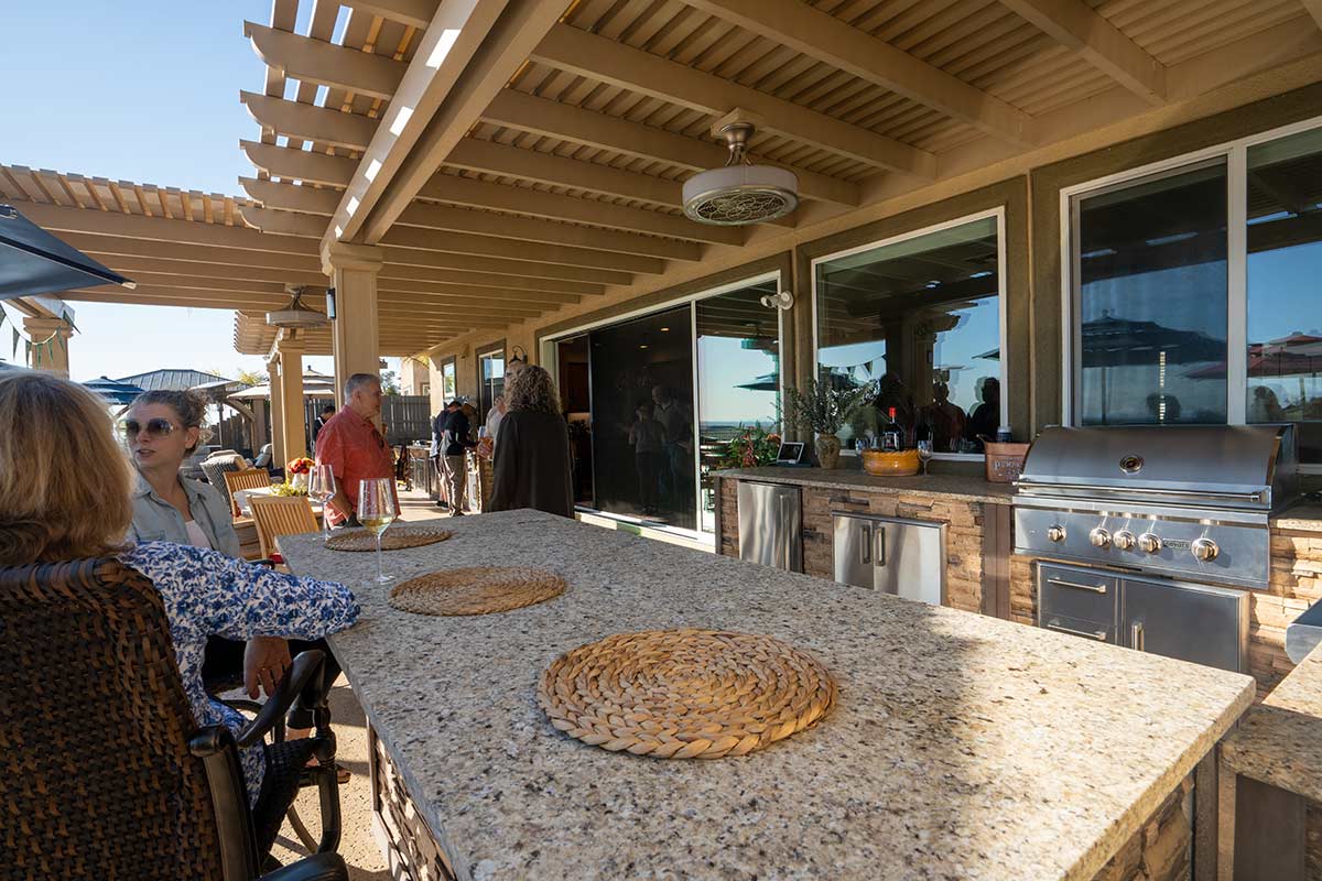 galley style rta outdoor kitchen with venetian gold granite countertop lifestyle