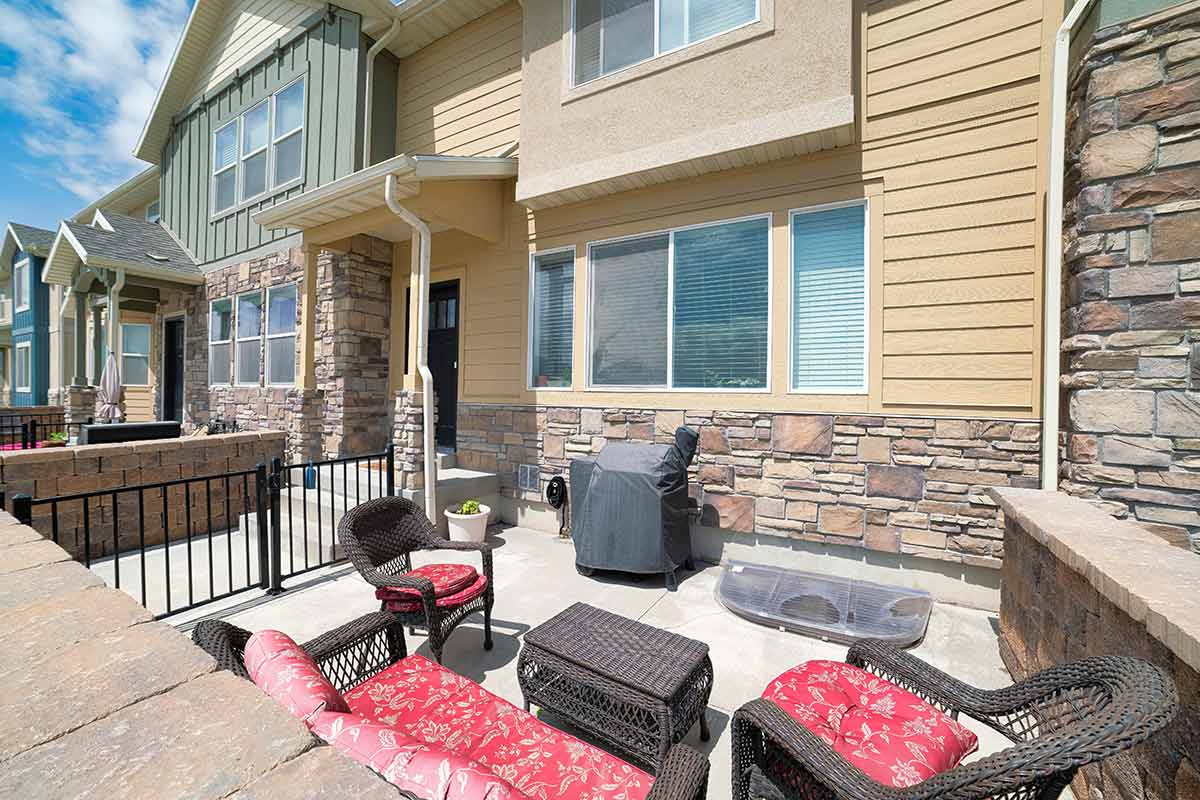 Patio with grill and furniture in the front of the house