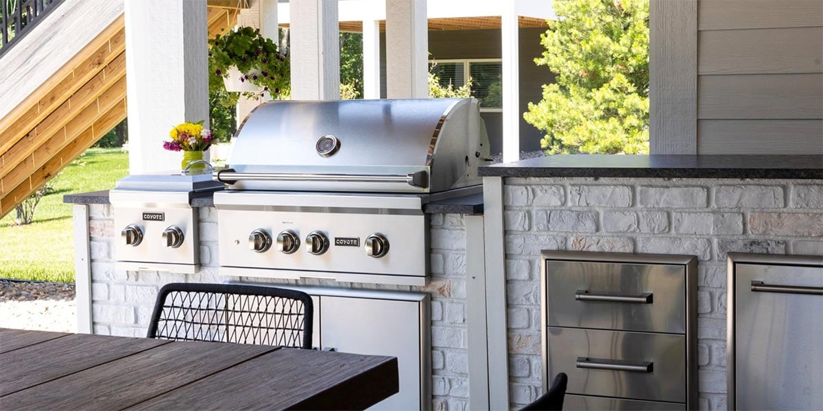 Coyote 36" S series grill in a linear rta outdoor kitchen in reclaimed brick