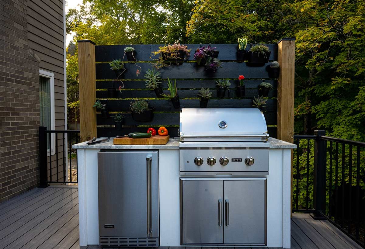 grill island in modern concrete with succulent plants