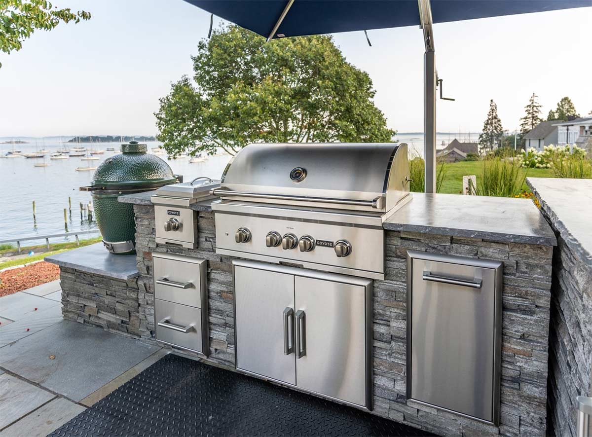 grill island with gas grill and big green egg style smoker