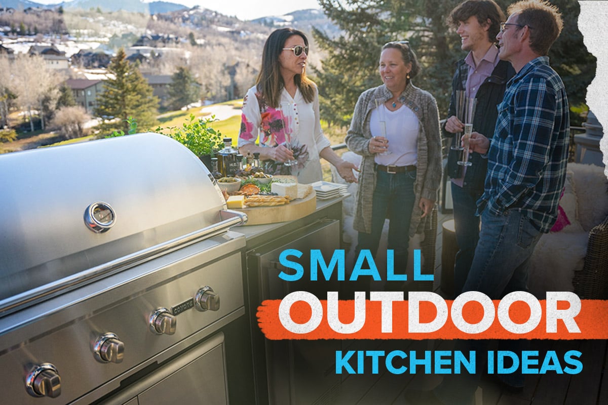Group of people chatting near an outdoor kitchen in the mountains