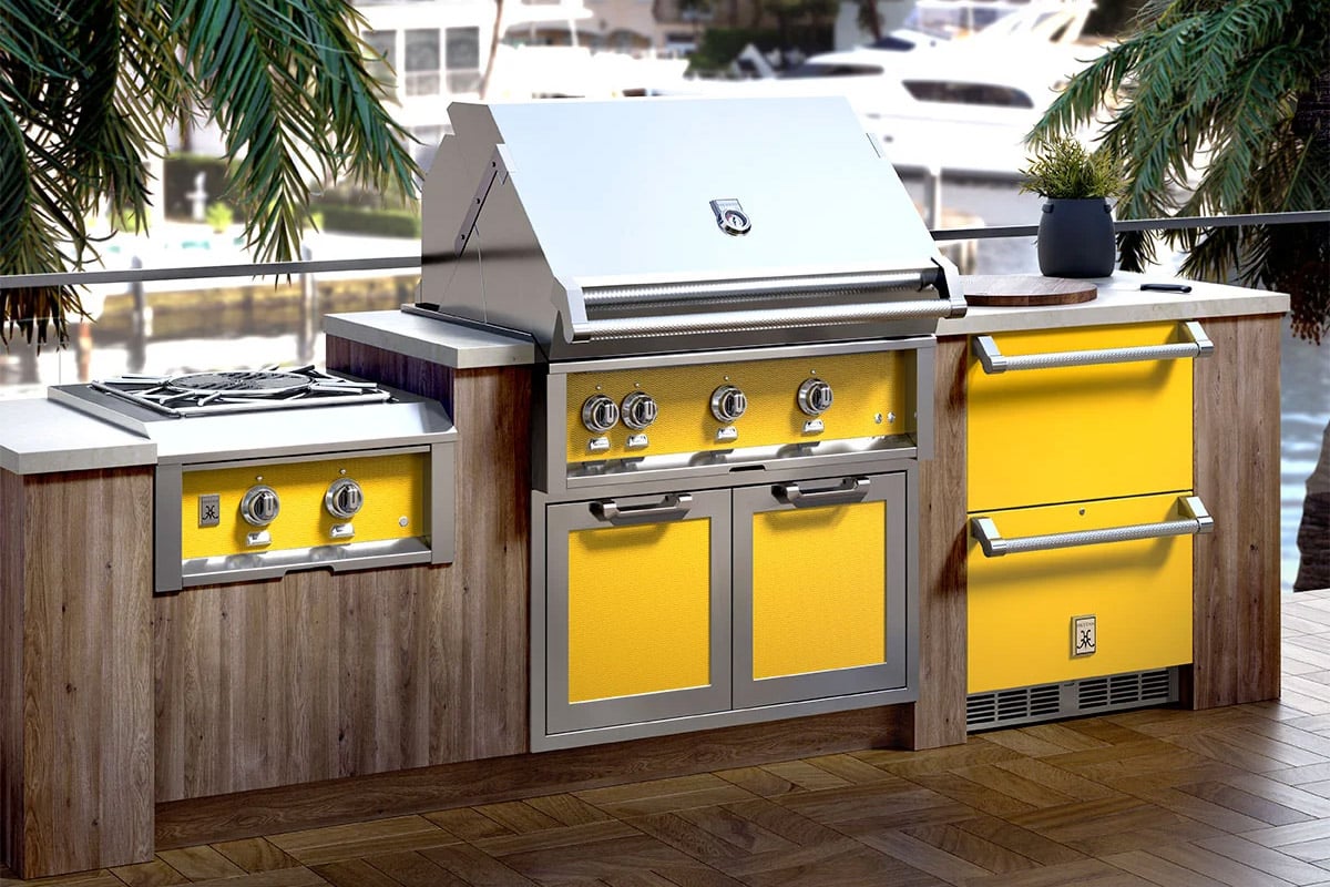 luxury hestan liquid propane stainless steel grill built into outdoor kitchen with matching appliances