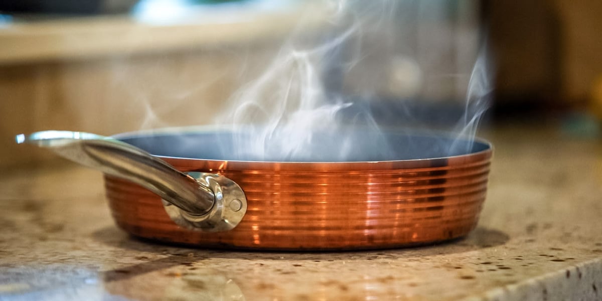 hot copper pan on stone countertop