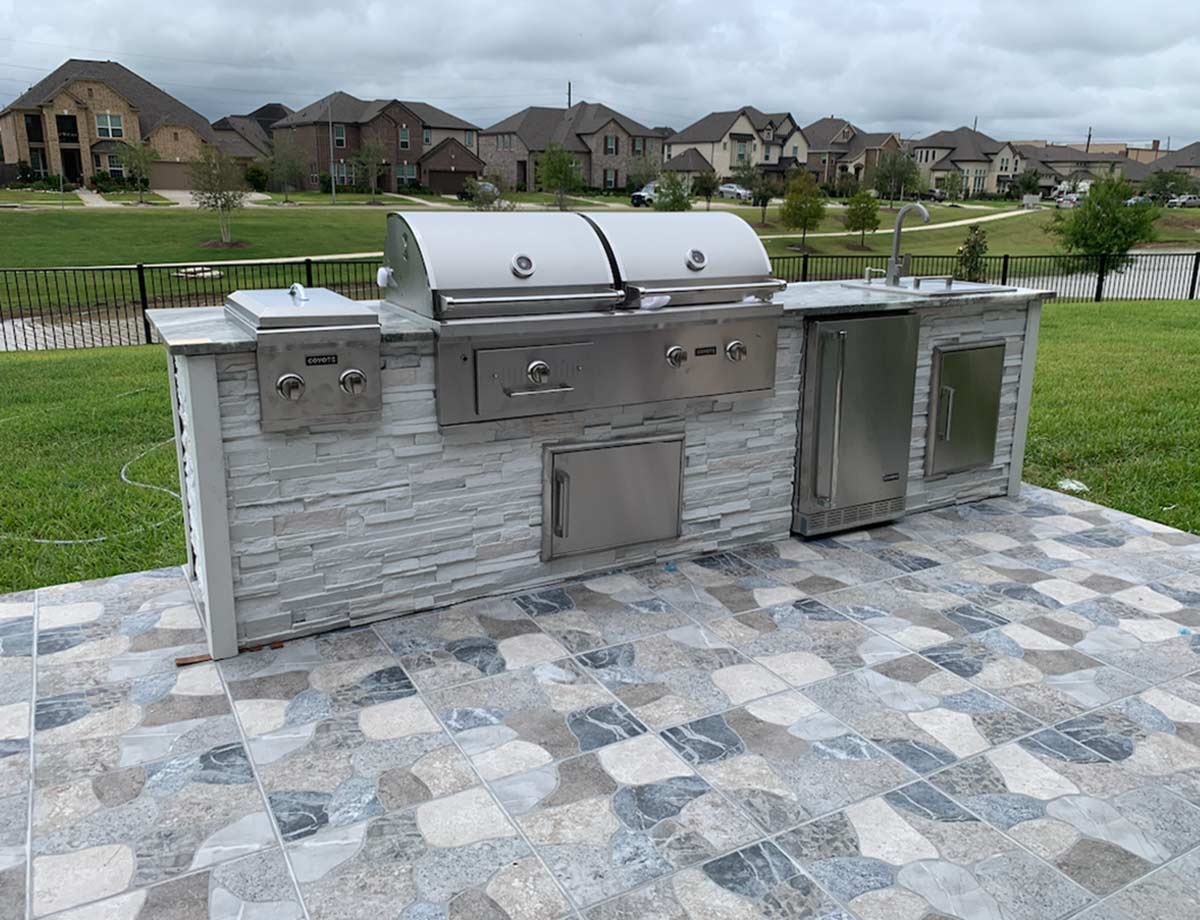 hybrid grill built into a linear grill island
