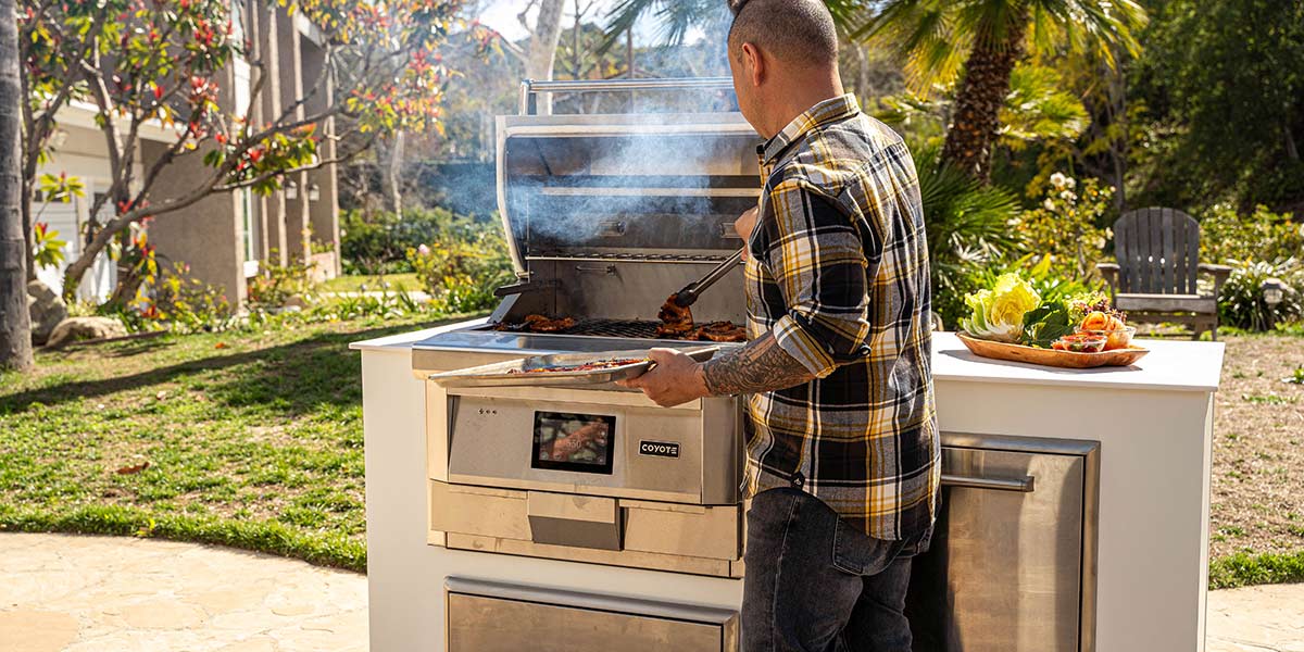Jet tila using his pellet grill to cook pork