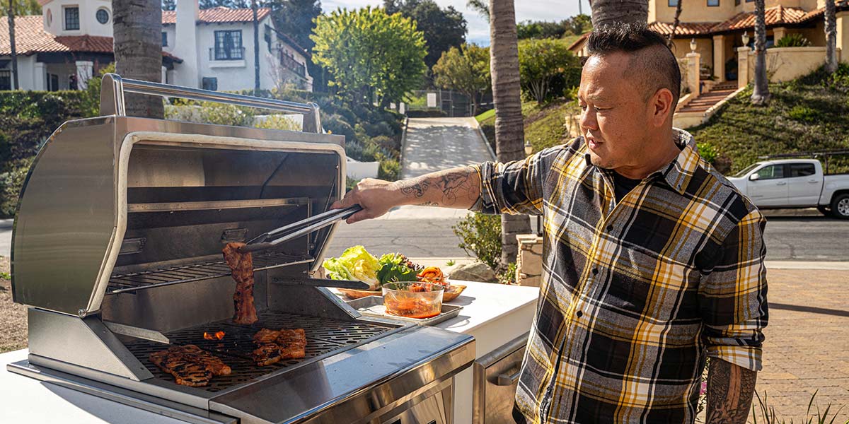 jet tila using his pellet grill