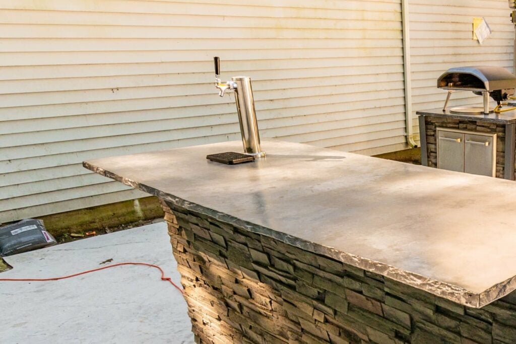kegerator built into outdoor kitchen bar
