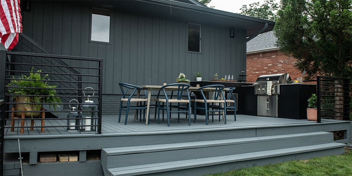 l shape outdoor kitchen on deck with seating