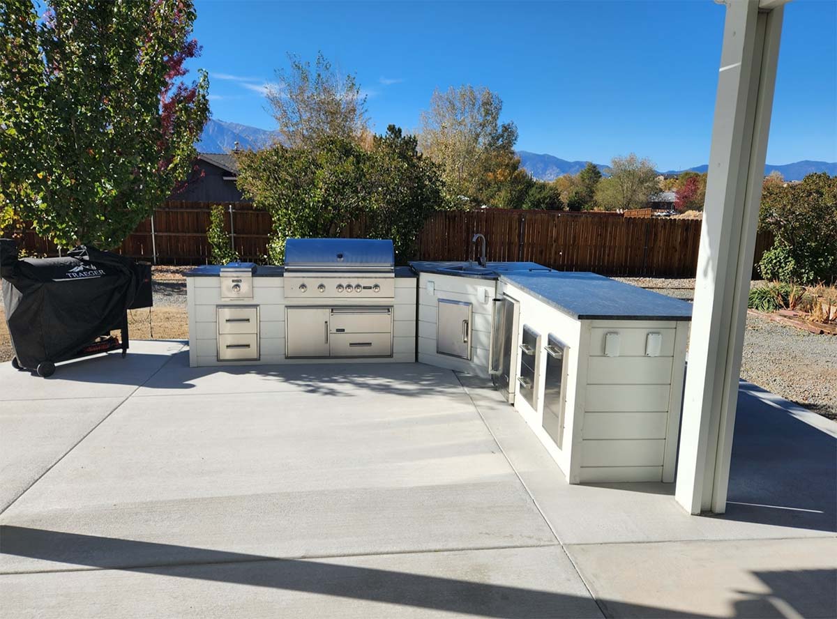 l shape outdoor kitchen with multiple exterior outlets