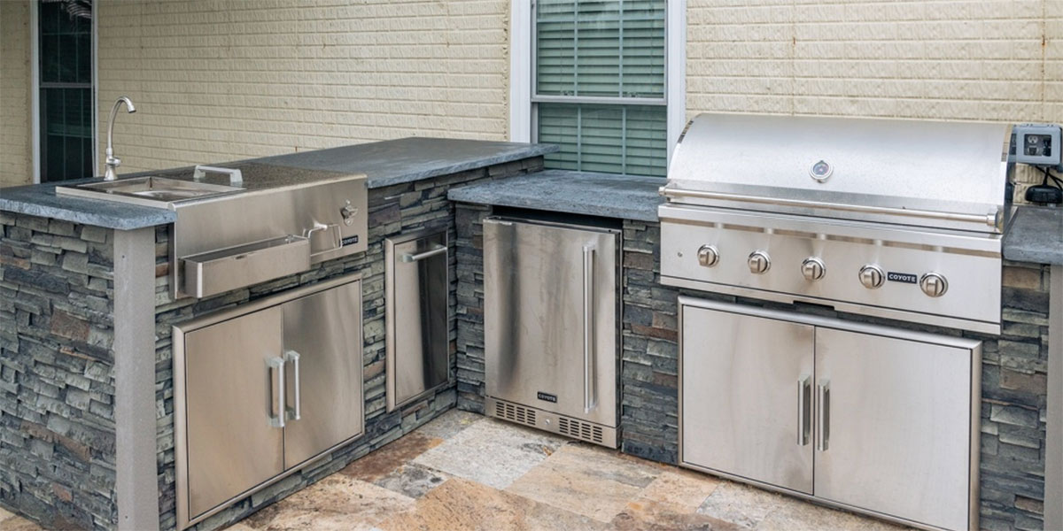 l shape outdoor kitchen with storage refrigerator and refreshment center
