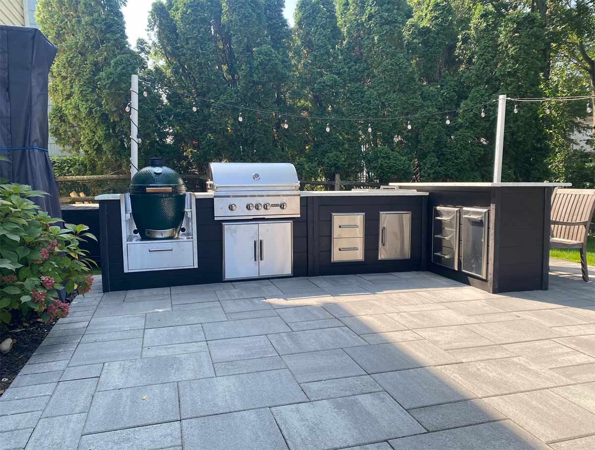 outdoor entertaining with modern luxury l shape plank outdoor kitchen