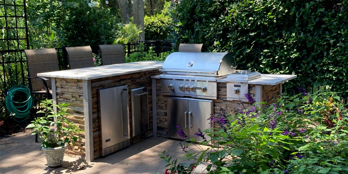 l shaped grill island with bar island and seating