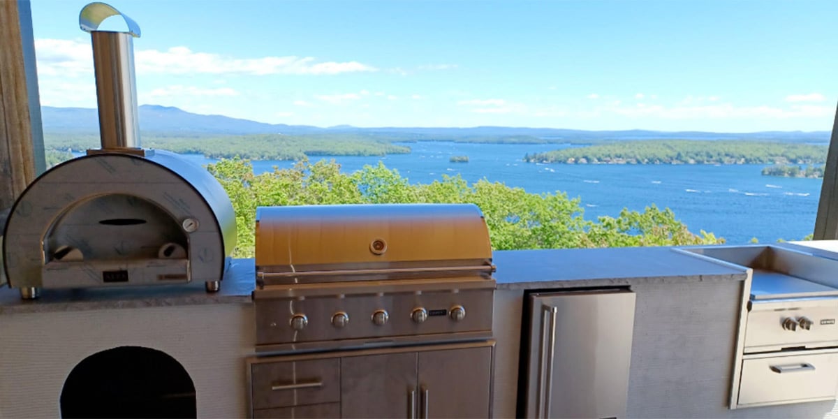 l shaped outdoor kitchen with outstanding lake views