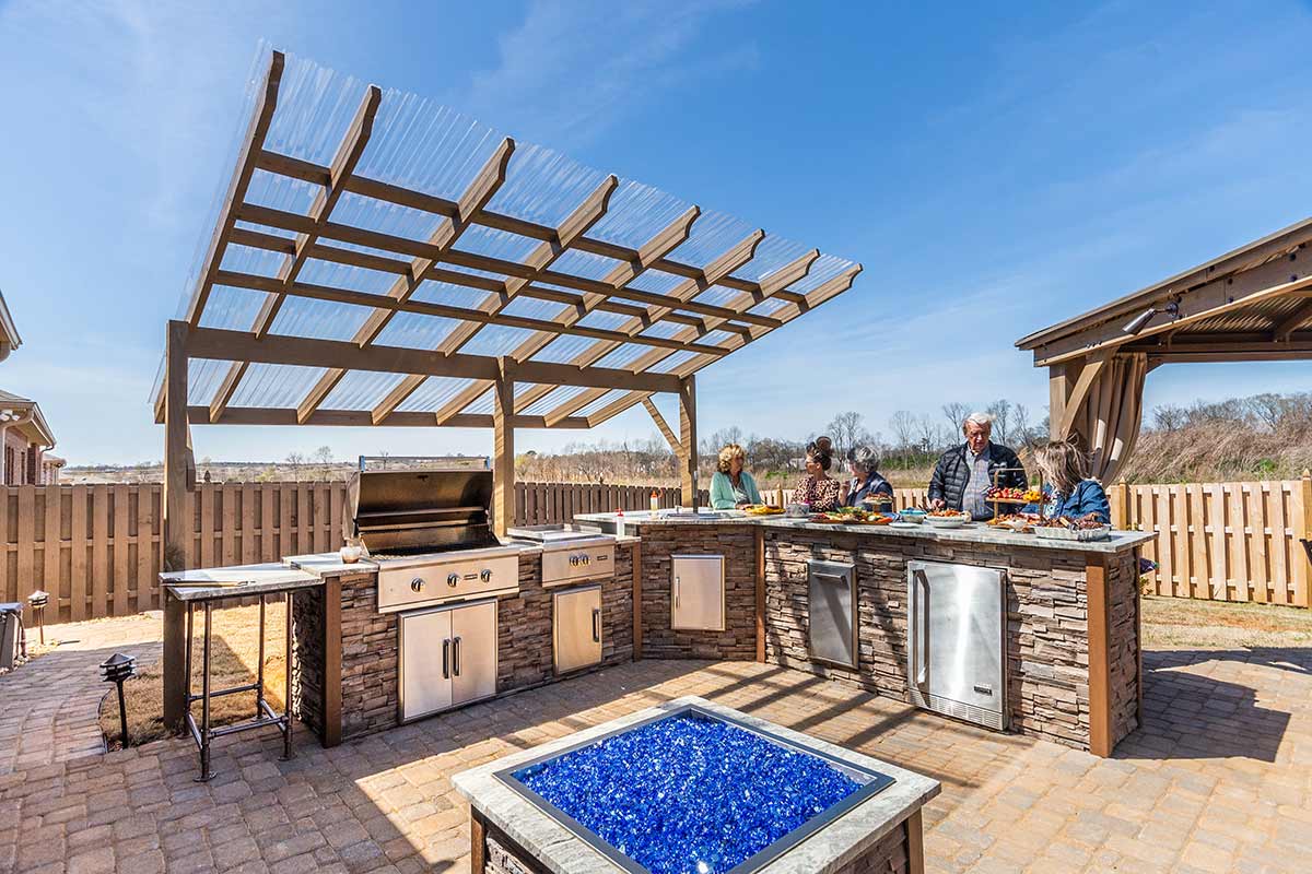 l shaped outdoor kitchen covered pergola with refrigerator and double burner