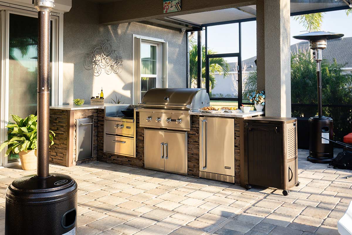 Outdoor covered grill station with grill, power burner, and more