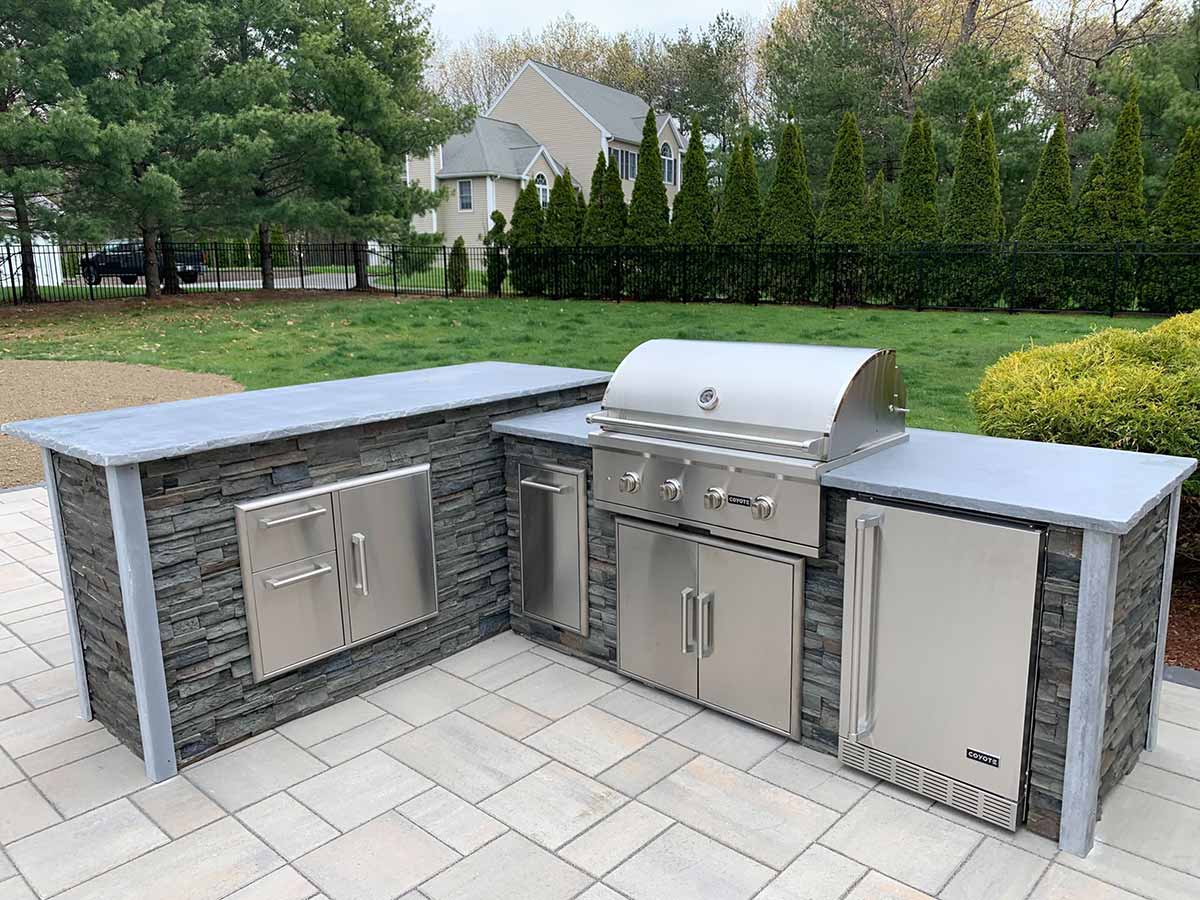 Outdoor patio grill station idea with combo storage, refrigeration, and a grill