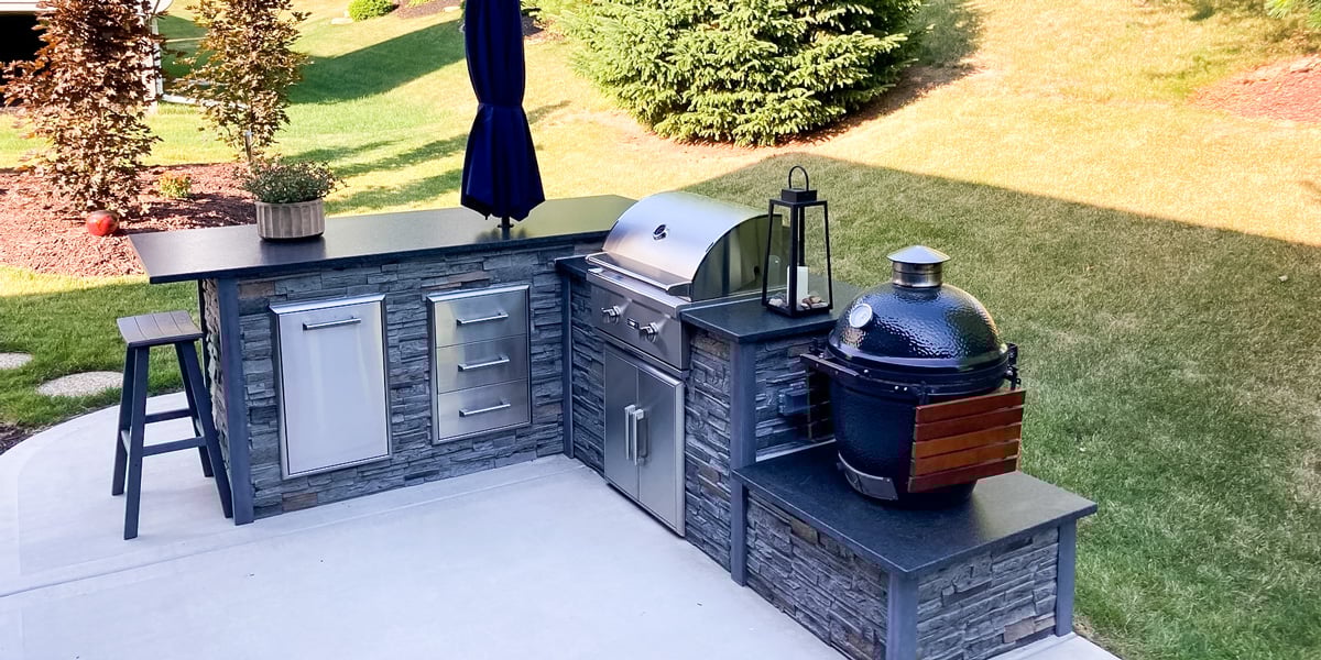 l shaped patio bbq island with small charcoal smoker